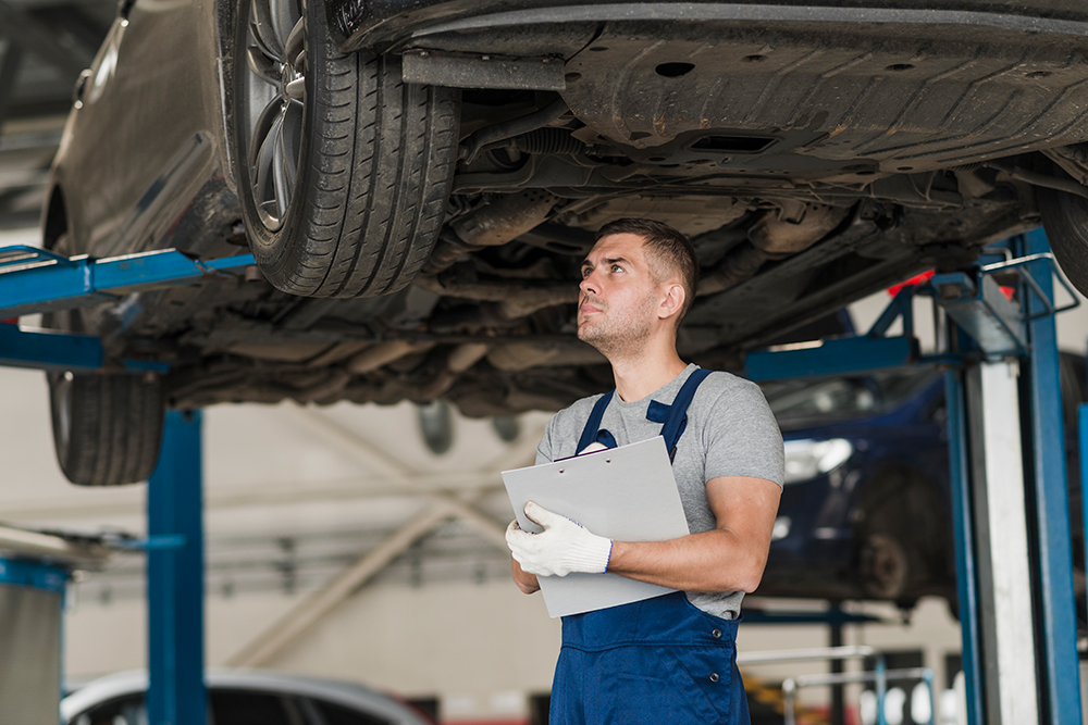 Mechanic showing a worn part